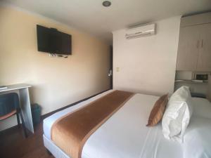 Hotel Portón Sabaneta客房内的一张或多张床位