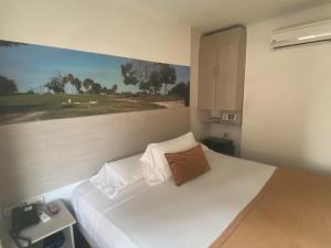 Hotel Portón Sabaneta客房内的一张或多张床位