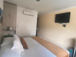 Hotel Portón Sabaneta客房内的一张或多张床位