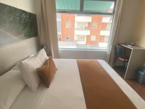 Hotel Portón Sabaneta客房内的一张或多张床位