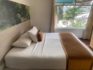 Hotel Portón Sabaneta客房内的一张或多张床位