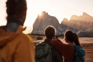 a group of people looking at the mountains at Alpenheim Charming & Spa Hotel in Ortisei