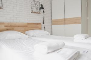 Postel nebo postele na pokoji v ubytování AL-DOM Apartamenty Summer 4