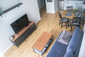 TV a/nebo společenská místnost v ubytování AL-DOM Apartamenty Summer 4