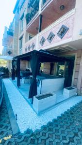 a black awning on the side of a building at Свети Йоан in Sozopol