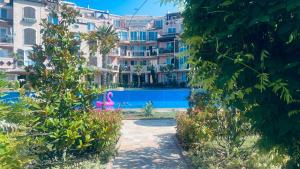 a resort with a swimming pool and a building at Свети Йоан in Sozopol