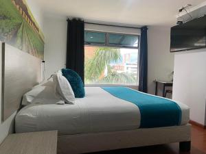 Hotel Portón Sabaneta客房内的一张或多张床位