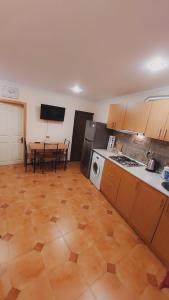 a kitchen with a table and a dining room at Buddha apartment in Tbilisi City