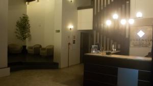 Uma área de estar em Essência Hotel Francisco Beltrão