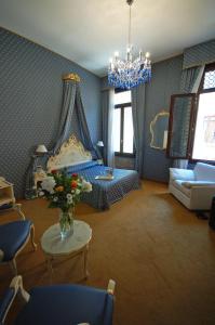 Postel nebo postele na pokoji v ubytování Hotel Torino