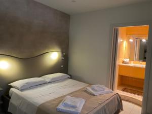Posteľ alebo postele v izbe v ubytovaní Akoya Rooms Capo Vaticano