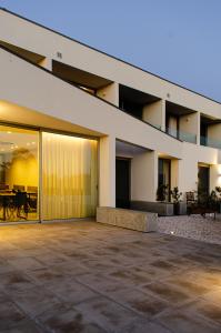 a building with a patio in front of it at Marinhas Bed & Breakfast in Esposende