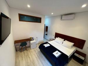 Voodi või voodid majutusasutuse Bistu Hotel - Vila Nova Conceição toas