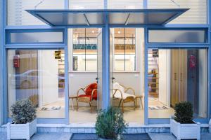 a table and chairs in front of a building at Duplex Rooms in Korçë