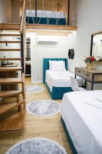 Postel nebo postele na pokoji v ubytování Duplex Rooms