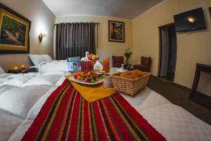 Postel nebo postele na pokoji v ubytování Hotel Cajamarca