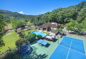 an aerial view of a tennis court at Owl Booking Villa Can Demana - Retreat in the Midst of Nature in Pollença