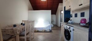 a kitchen with a table and a sink and a room at Penthouse with Terrace in Santa Maria Ca Firenze Sal Service in Santa Maria +18 photos