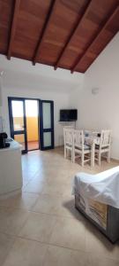 a large living room with a table and chairs at Sal Service new studio penthouse in Santa Maria