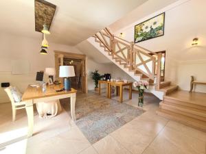 a home office with a desk and a staircase at Gościniec Iłżanka in Iłża