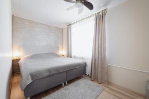Postel nebo postele na pokoji v ubytování Kuuse 4 Apartment with 2 bedrooms