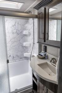 a bathroom with a sink and a shower at H - Driftwood in Fort Bragg