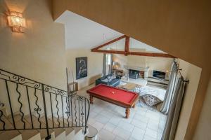 an overhead view of a living room with a pool table at Le Mas de Sevrier in Sévrier