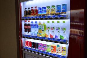 a refrigerator filled with lots of different types of drinks at Hotel Tetora in Hakodate