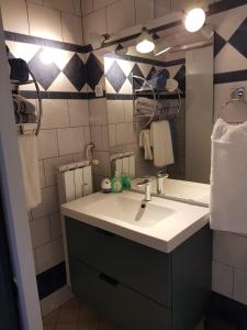 a bathroom with a sink and a mirror at A place to relax in Ljubljana