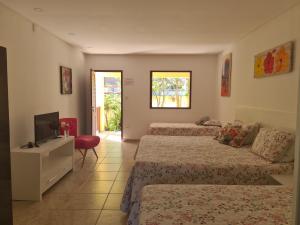 TV a/nebo společenská místnost v ubytování Condomínio Oasis das Flores