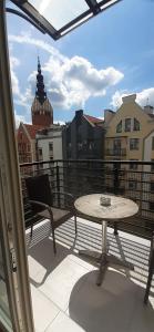 A balcony or terrace at Oasis, Old Town Apartment