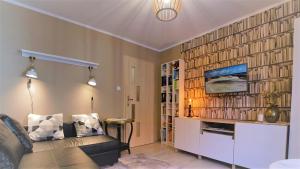 Μια τηλεόραση ή/και κέντρο ψυχαγωγίας στο Casa in Centro Apartments and more
