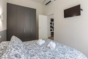 Łóżko lub łóżka w pokoju w obiekcie La Boutique Milano: appartamento in Porta Romana