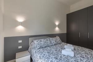 Łóżko lub łóżka w pokoju w obiekcie La Boutique Milano: appartamento in Porta Romana