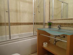 a bathroom with a sink and a shower and a tub at SUDWEST ROOMS by Stay in Alentejo for HIKERS in Vila Nova de Milfontes +12 photos