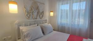 Ένα ή περισσότερα κρεβάτια σε δωμάτιο στο Diana's Luxury Suites