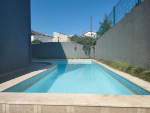 a swimming pool in the backyard of a house at Hotel Vila in Guimarães