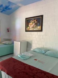 Cama o camas de una habitación en Chale Praia Residence