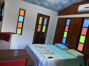 Cama o camas de una habitación en Chale Praia Residence