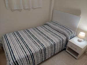Cama o camas de una habitación en Metrópolis Apartaments for Rent