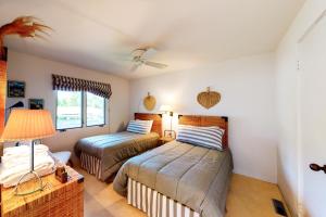 a bedroom with two beds and a lamp at Rockledge in North Hero