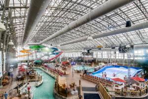 a large indoor water park with a large swimming pool at Slopeside 705 in Jay