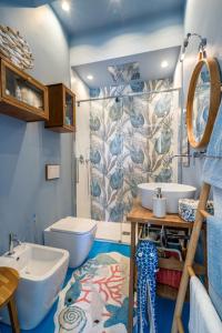 a bathroom with two sinks and a toilet at La Casa di Nonna Piera in Giardini Naxos +68 photos