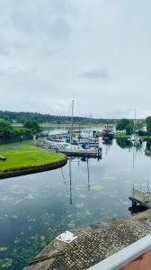 a marina with boats docked in the water at Custom House Hotel in Bowling