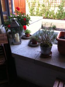 a stone counter with potted plants and a candle at Beautiful apartment central location in Dublin