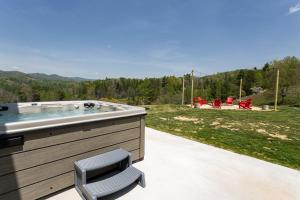 a jacuzzi tub sitting on a patio at Brackens View Retreat in Marshall