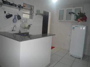 Η κουζίνα ή μικρή κουζίνα στο Kit Net, Prox ao Centro +2 φωτογραφίες