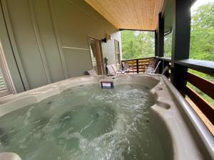 a jacuzzi tub in the middle of a house at The Sunny Side in Asheville