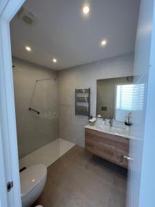 Koupelna v ubytování Apartamento La Canela + 34 fotografií