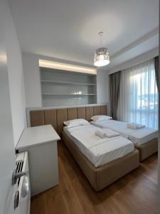 Ένα ή περισσότερα κρεβάτια σε δωμάτιο στο BLANC 7